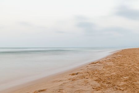 Long exposure view of beach in Mediterranean Sea, Oliva, Valenciaの写真素材
