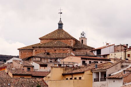 View of the medieval town of Pastrana with tile roofs and traditional houses. La Alcarria, Guadalajara, Spainの写真素材