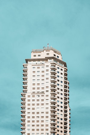 Madrid, Spain - November 1, 2019: Tower of Madrid skyscraper in Square of Spain. Low angle view against blue skyのeditorial素材