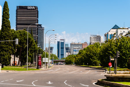 Empty view of the road of Paseo de la Castellana avenue in Madrid against modern skyscrapersのeditorial素材
