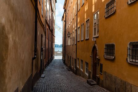 Narrow cobblestoned street in Gamla Stan, the medieval Old Town of Stockholmの写真素材
