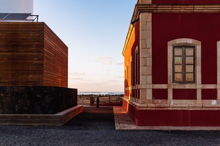 Scenic view of El Toston Lighthouse in Canary Islands amidst volcanic landscapeのeditorial素材