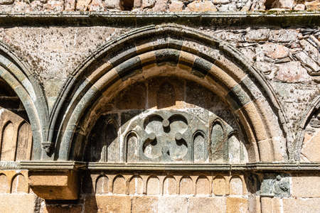 Arch of stone in medieval abbeyの写真素材