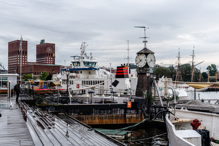 View of the port of Aker Brygge with City Hall of Osloのeditorial素材