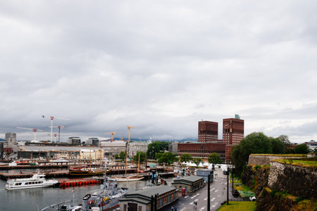 View of the port of Aker Brygge with City Hall of Osloのeditorial素材
