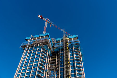 Low angle view of skyscraper under constructionのeditorial素材
