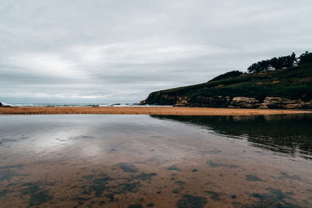 Scenic view of lonely beach a cloudy day of summerの写真素材