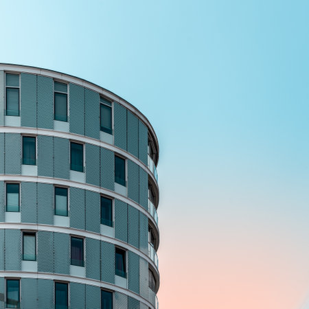 Minimalist apartment building in Hamburg against beautiful orange and teal blue sky