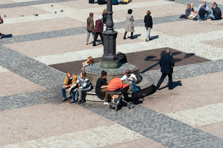 People enjoying sitting or walking in Plaza Mayor Square in Madridのeditorial素材