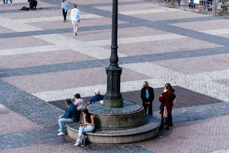 People enjoying sitting or walking in Plaza Mayor Square in Madridのeditorial素材