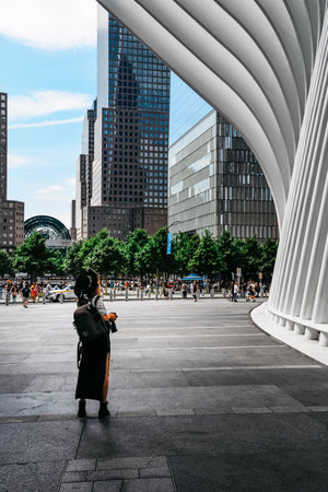 Tourist taking photos to futuristic building in New Yorkのeditorial素材