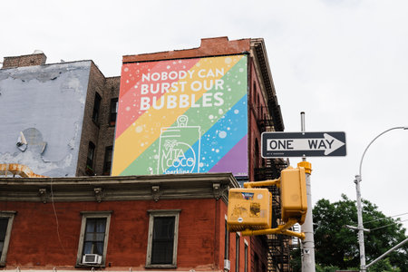 Advertising billboard of Vita Coco on the facade of a traditional building in Greenwich Village in New Yorkのeditorial素材