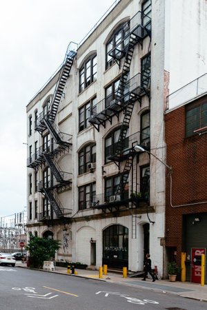 Traditional Brooklyn building with fire escapes. New York City