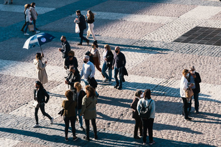 People enjoying sitting or walking in Plaza Mayor Square in Madridのeditorial素材