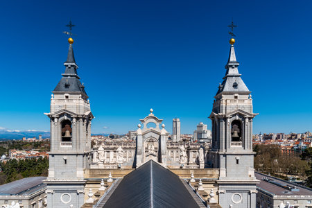The roof and the bell towers of Almudena Cathedral against cityscape of Madridのeditorial素材