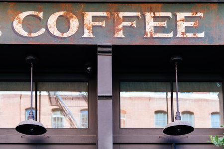 Coffee sign on Top of vintage or retro style store windowの写真素材