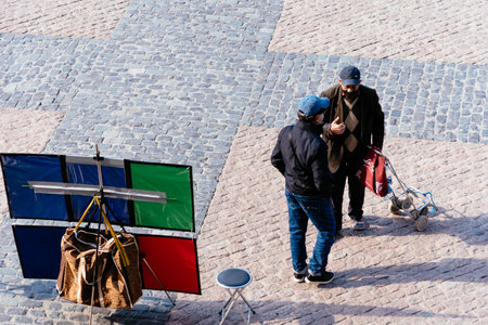 Street artist waiting for tourists to draw cartoons in Plaza Mayor in Madridのeditorial素材