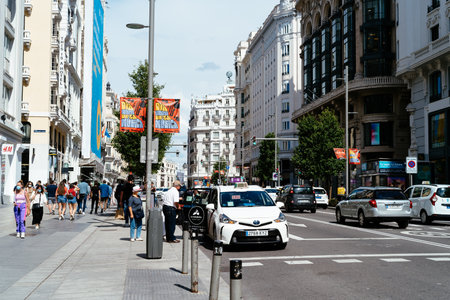 Busy street scene in Gran Via Avenue in Madridのeditorial素材