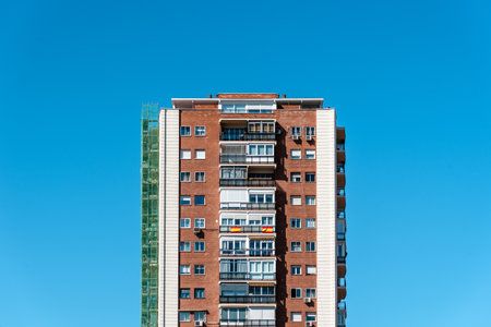 Apartment Building against blue sky in Madrid, Spainの写真素材