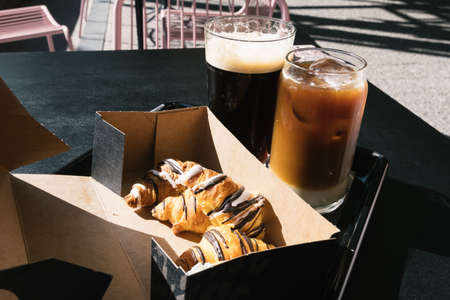 Two Glasses of Cold Brew Coffee and croissantsの写真素材