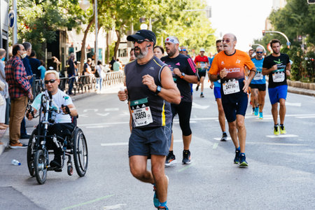Group of runners in full effort during the Madrid marathon raceのeditorial素材