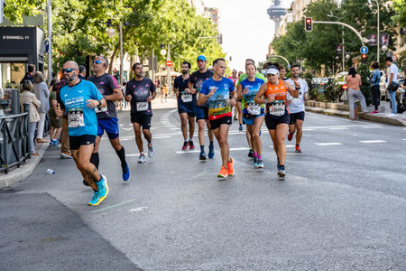 Group of runners in full effort during the Madrid marathon raceのeditorial素材