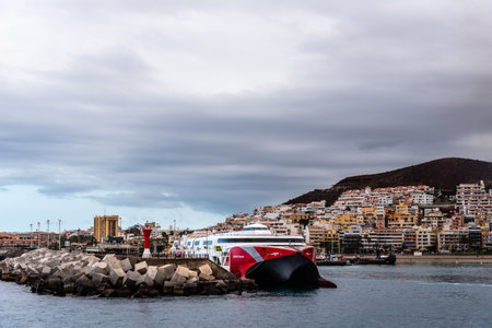 The harbour of Los Cristianos with ferry ready to departのeditorial素材