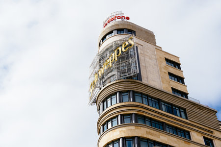Iconic Capitol Building in Callao Square in Gran Via in Madridのeditorial素材