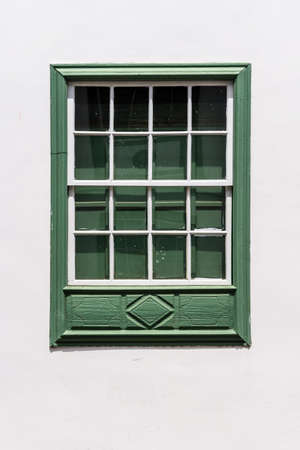 Traditional painted window in canarian colonial style house in the old town of Santa Cruz de La Palmaの写真素材