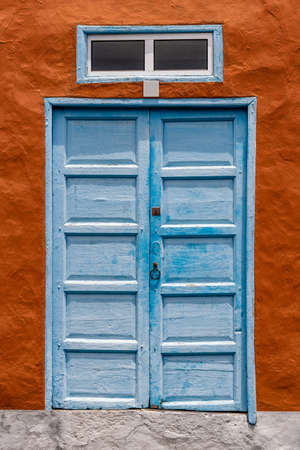 Traditional painted door in canarian colonial style house in the old town of Santa Cruz de La Palmaの写真素材