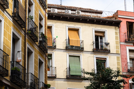 Old residential building facade against sky in Madrid