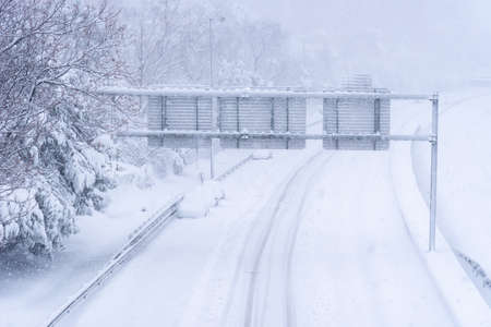 View of a highway in the city covered in snow during heavy snowfallの写真素材