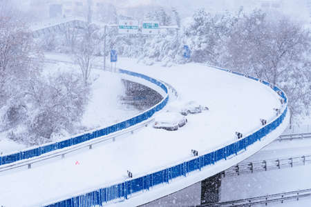 View of a highway in the city covered in snow during heavy snowfallの写真素材