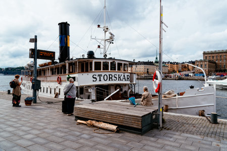 People waiting to board the transport ship at the pier in Stockholmのeditorial素材