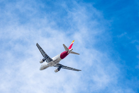 Airbus A319 passenger aircraft of the airline Iberia flying after takeoffのeditorial素材