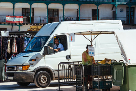 Merchant van in the street market of the Plaza Mayor of Chinchonのeditorial素材