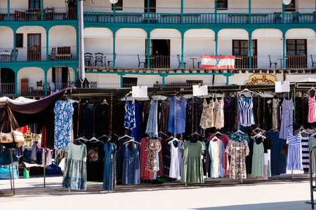 Clothing stalls in the street market of the Plaza Mayor of Chinchonのeditorial素材
