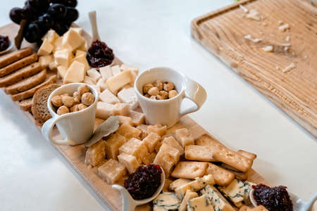Cheeses selection with raspberry jeam and walnutsの写真素材