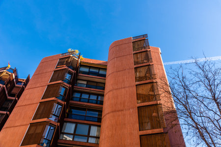 Famous residential building with brick facade in Barrio of Salamanca in Madrid
