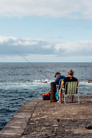 Fisherman fishing in the old port of Garachicoのeditorial素材
