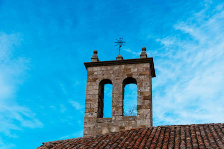 Bell tower of a medieval stone church in the historic town of Atienzaの写真素材