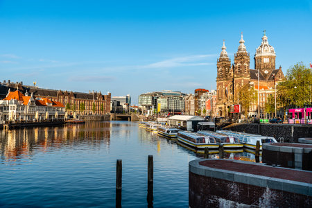 Central Station and canal in Amsterdam, Netherlandsのeditorial素材