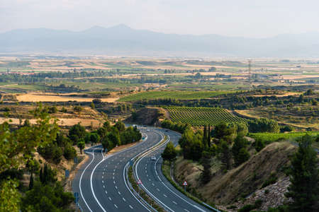 Aerial view of highway through mountains in Rioja Regionの写真素材