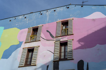 Vibrant painted facades in a typical street in Lavapies quarter in Madridのeditorial素材