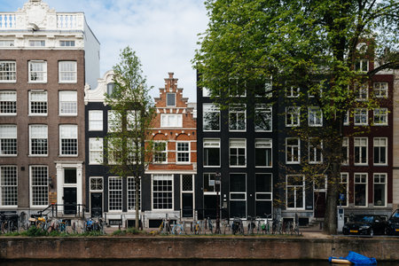 Scenic view of the waterfront of canal with typical Dutch houses in Amsterdamのeditorial素材