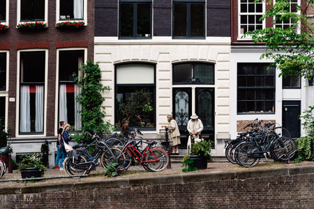 Scenic view of the waterfront of canal with typical Dutch houses in Amsterdamのeditorial素材