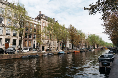 Scenic view of the waterfront of canal with typical Dutch houses in Amsterdamのeditorial素材
