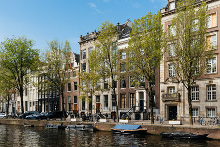Scenic view of the waterfront of canal with typical Dutch houses in Amsterdamのeditorial素材