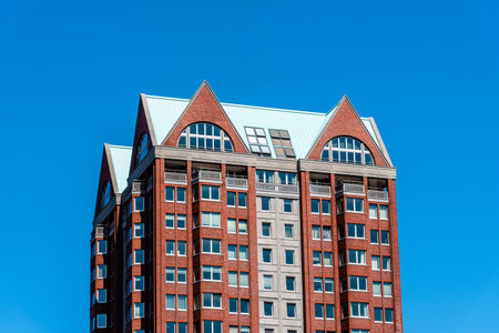 Residential skyscraper against blue sky in the city of Rotterdamのeditorial素材