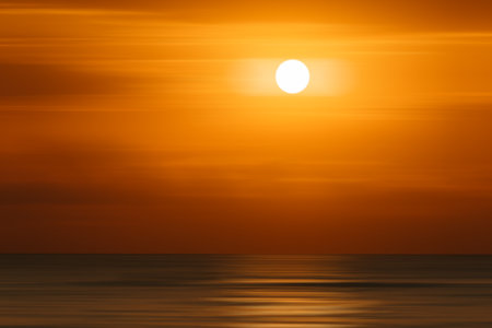 Bright dramatic orange sunrise over Mediterranean seaの写真素材
